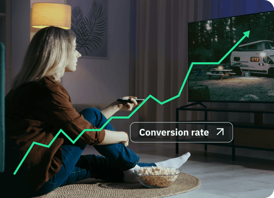 Woman watching TV with conversion rate trending up